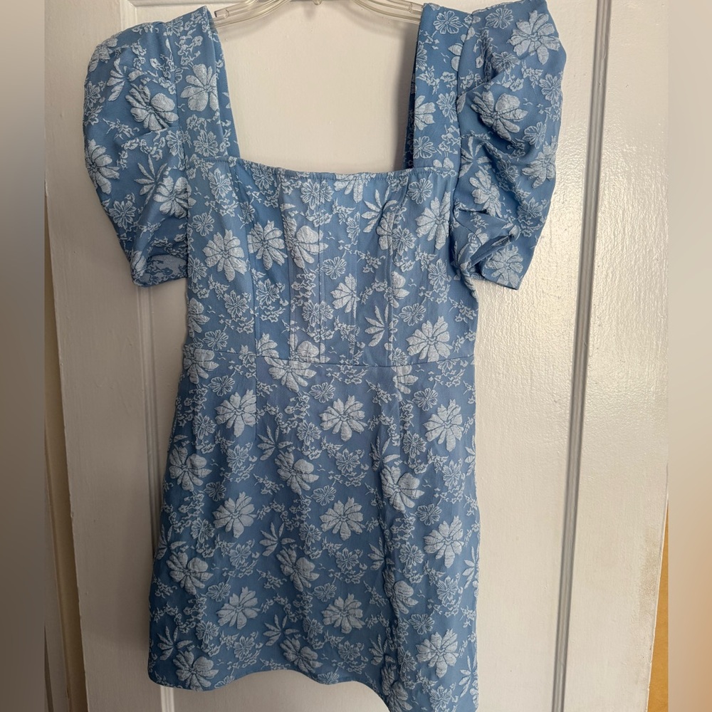 This stunning denim like floral dress is a perfect blend of style and comfort.